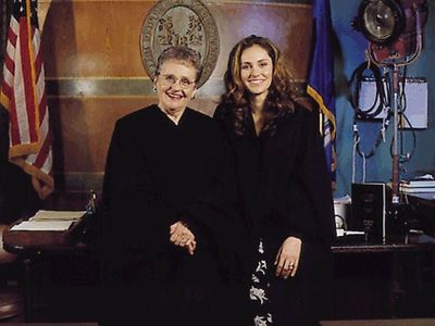 Both Amy Brenneman and Frederica Joanne Shoenfield are wearing a court uniform.
